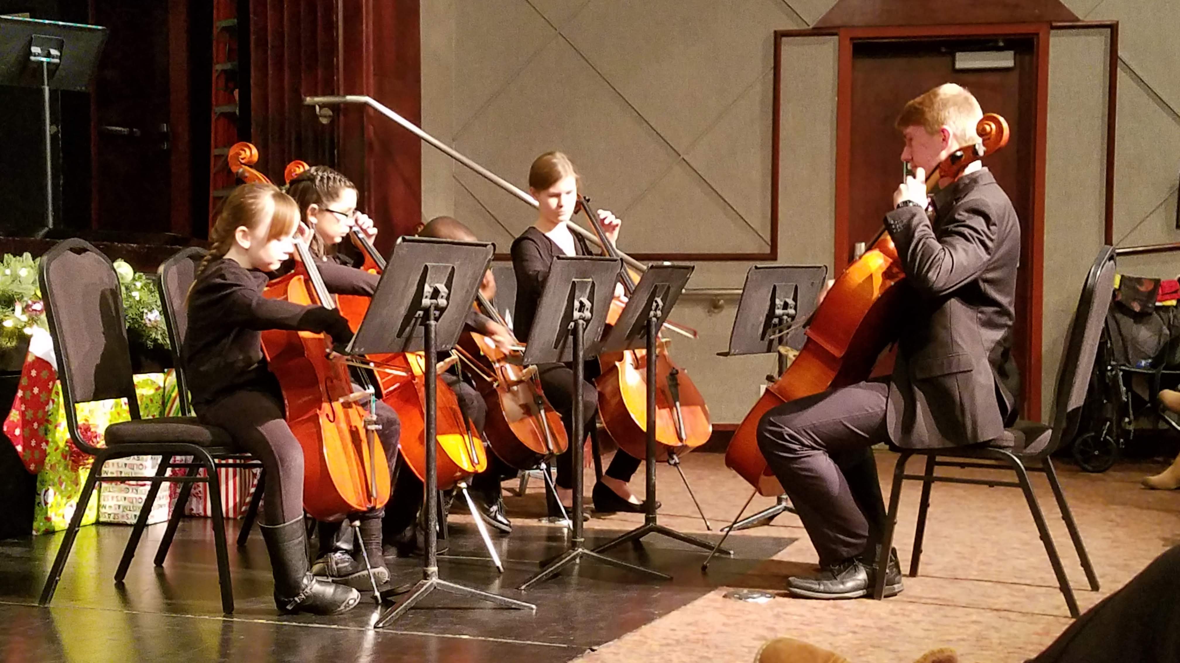 Nathaniel guides students in a concert.